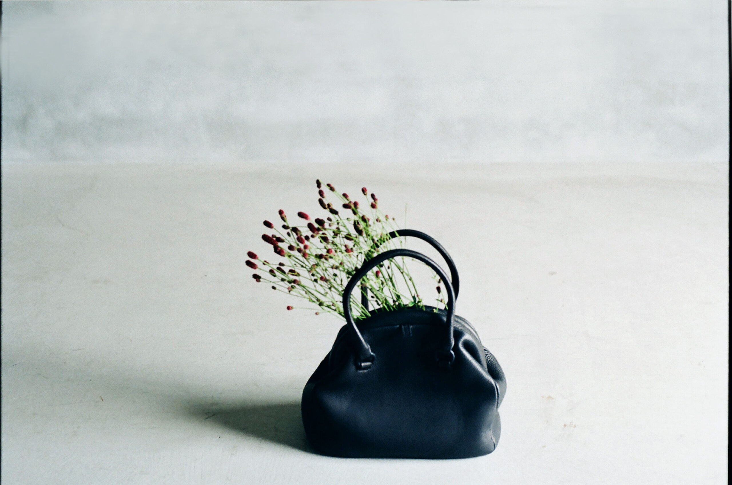 deer leather kiss lock bag made from natural materials with soft texture