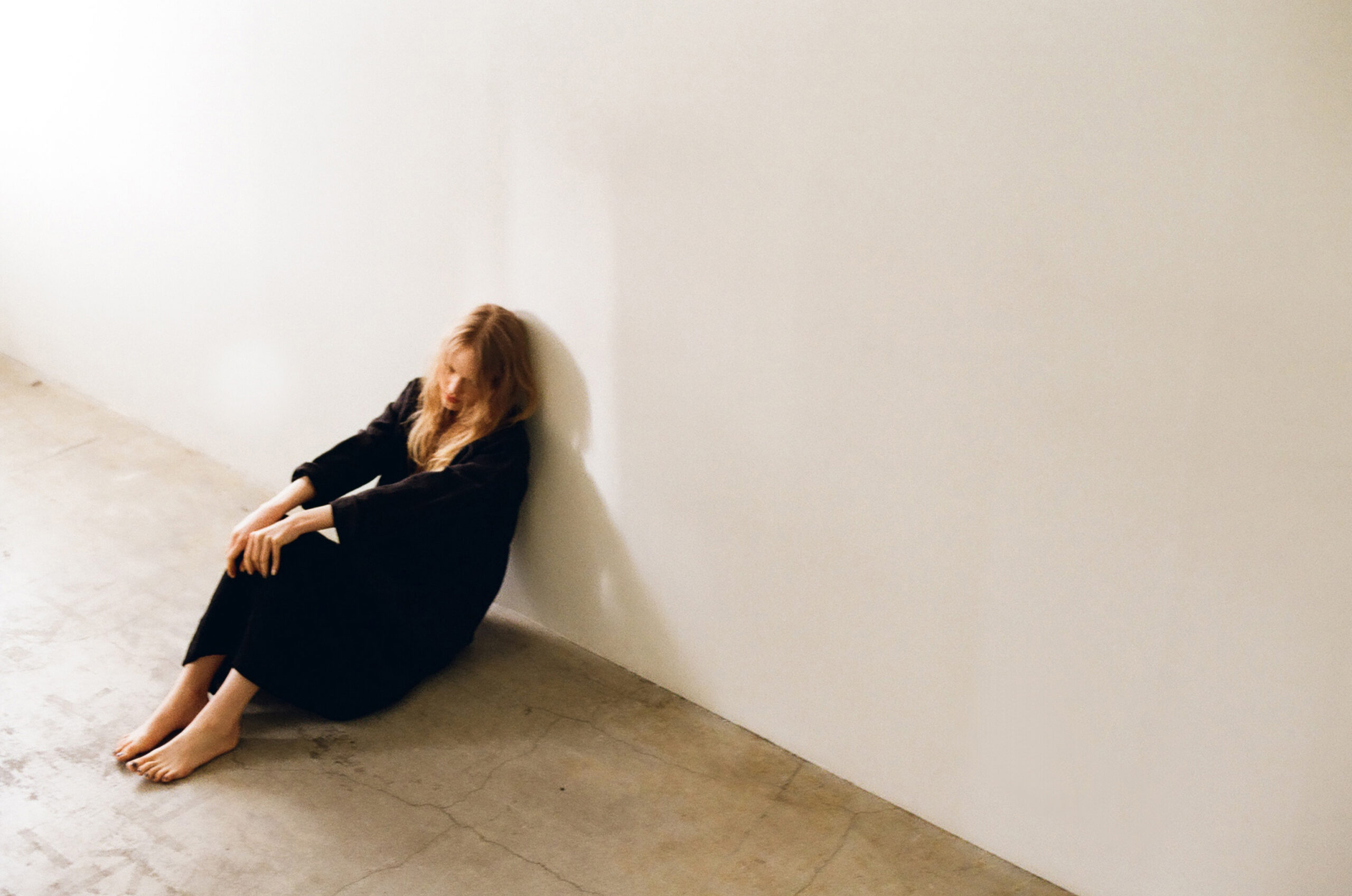 mochi 2026 spring summer relaxed black dress seated soft light