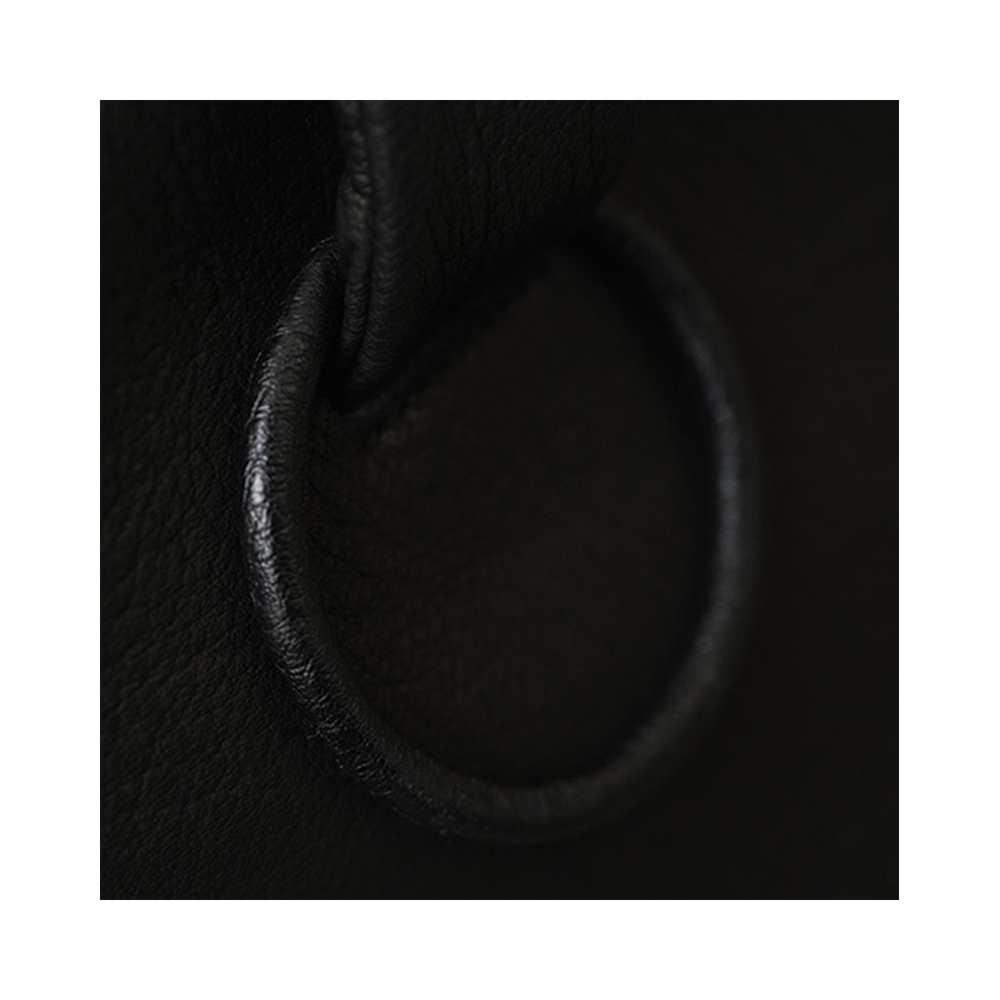 leather ring detail, soft texture and minimal design