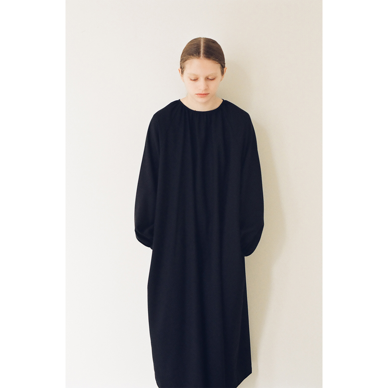 Front view of a black dress in the Mochi 2026 Autumn Winter image look.