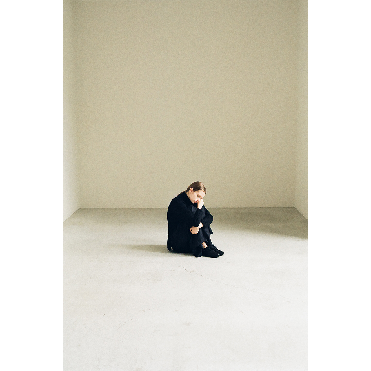 Model wearing a black knit with wide pants in the Mochi 2026 Autumn Winter image look.